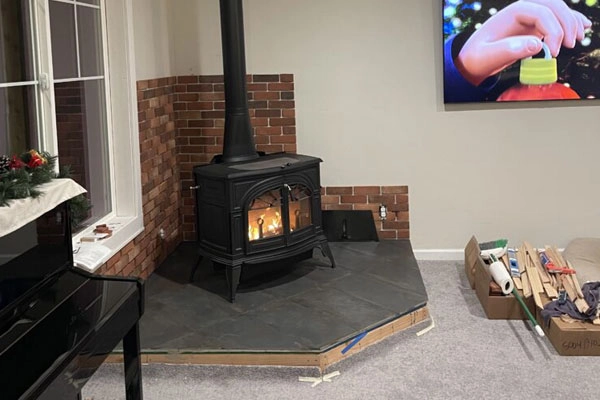A mounted television complements the fireplace repaired by Safer Chimney LLC in Boise, ID.